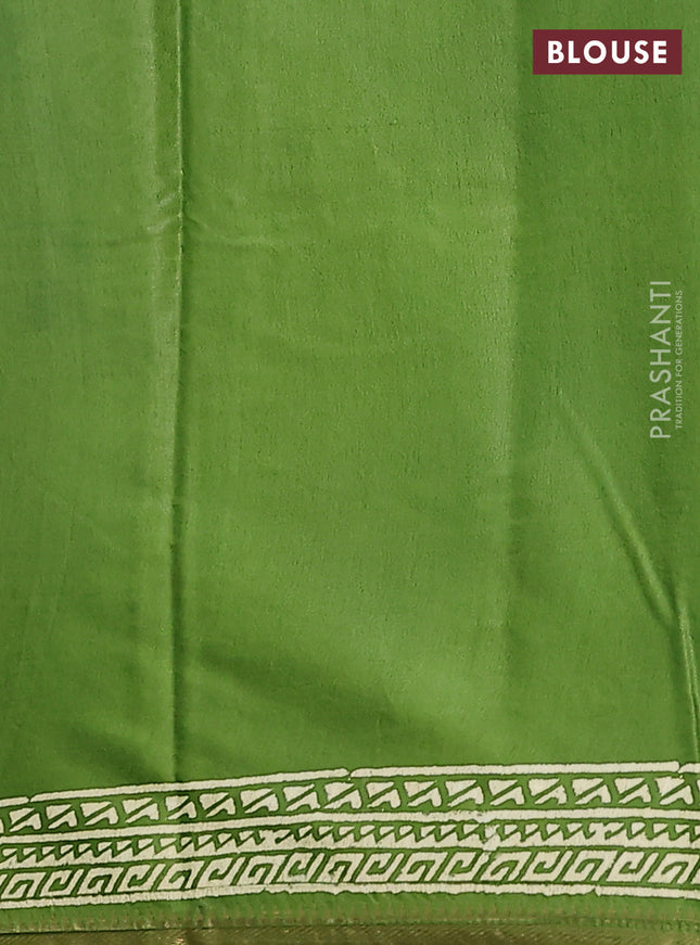 Semi bhagalpuri saree light green with allover prints and zari woven border