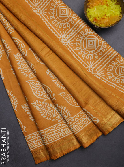 Semi bhagalpuri saree mustard yellow with allover prints and zari woven border