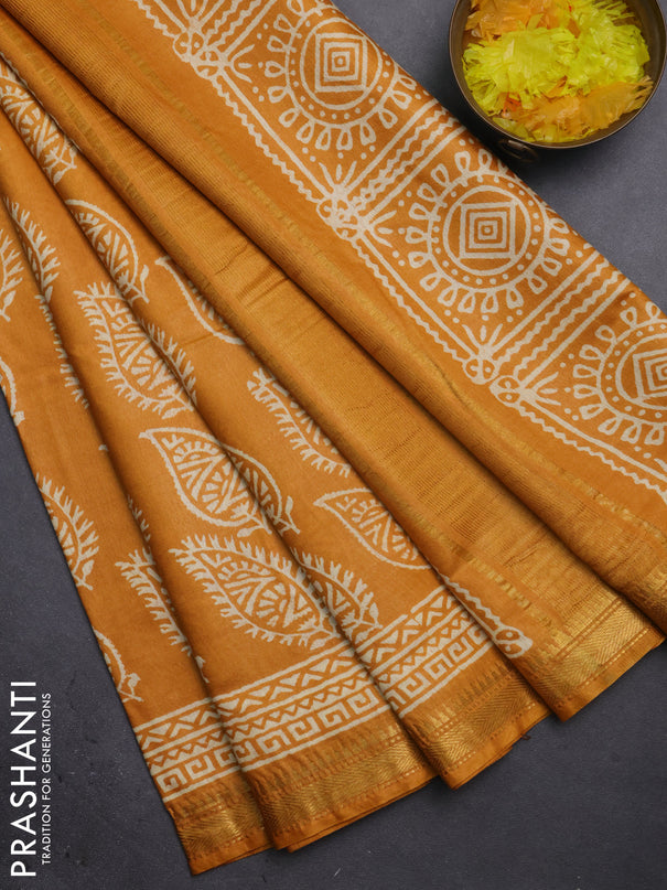 Semi bhagalpuri saree mustard yellow with allover prints and zari woven border