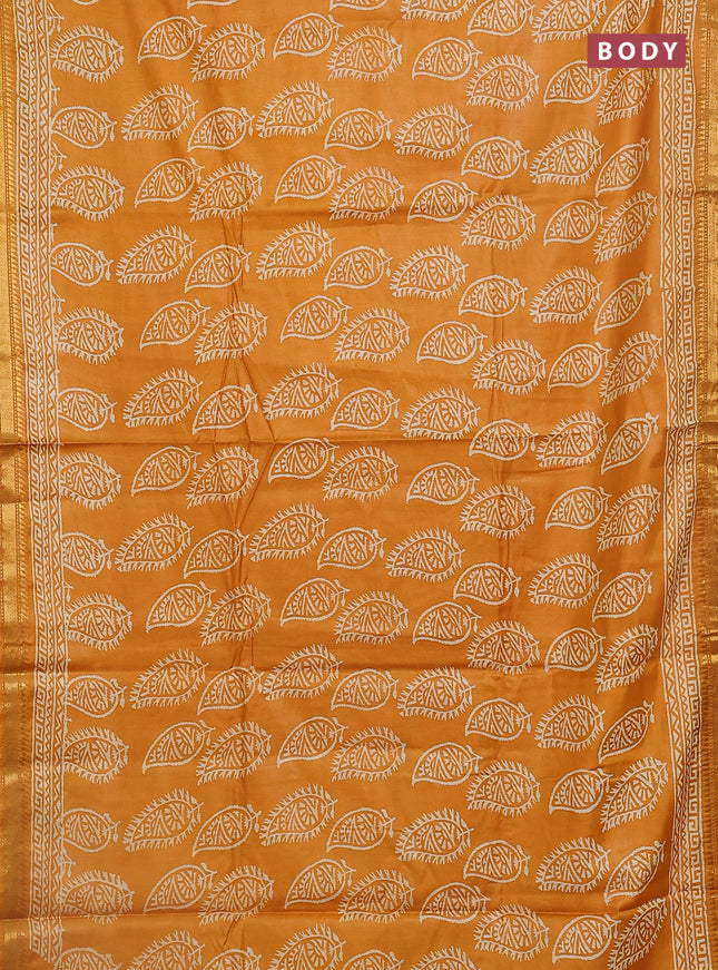 Semi bhagalpuri saree mustard yellow with allover prints and zari woven border
