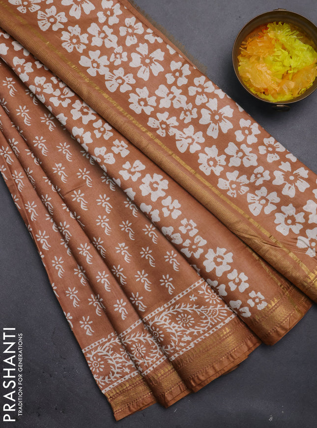 Semi bhagalpuri saree sandal with allover prints and zari woven border