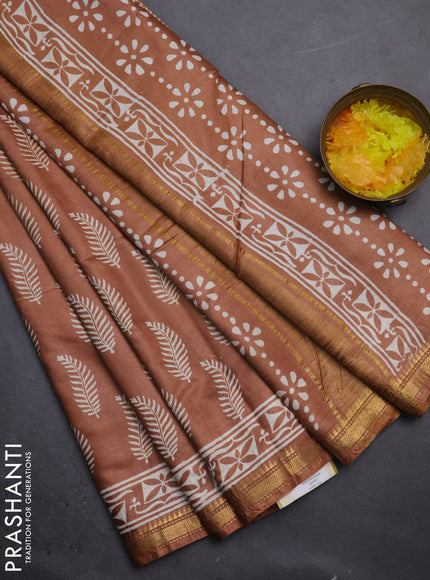Semi bhagalpuri saree sandal with allover prints and zari woven border