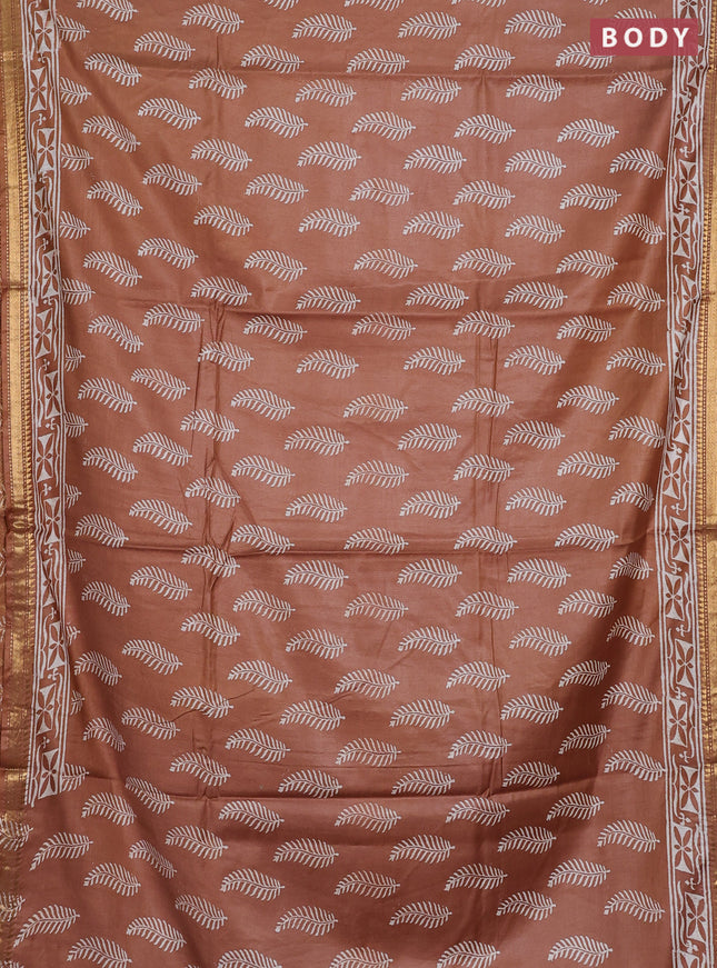 Semi bhagalpuri saree sandal with allover prints and zari woven border