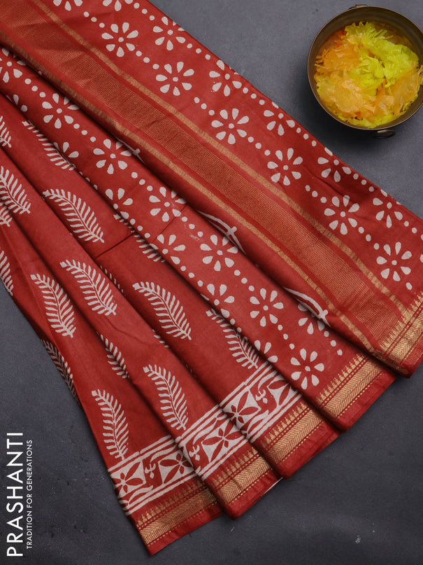 Semi bhagalpuri saree rust with allover prints and zari woven border