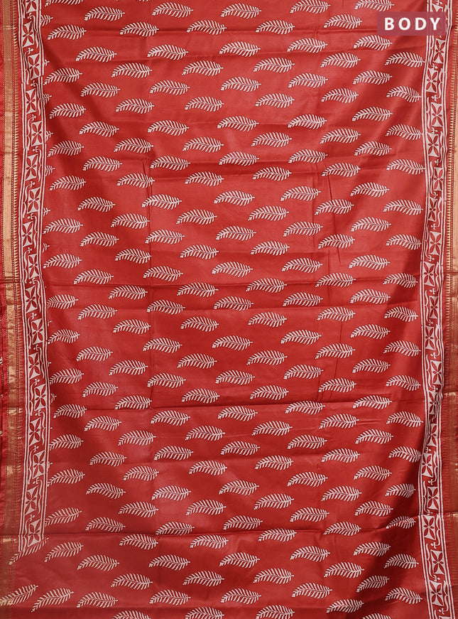 Semi bhagalpuri saree rust with allover prints and zari woven border