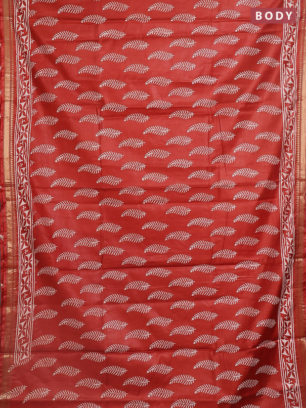 Semi bhagalpuri saree rust with allover prints and zari woven border
