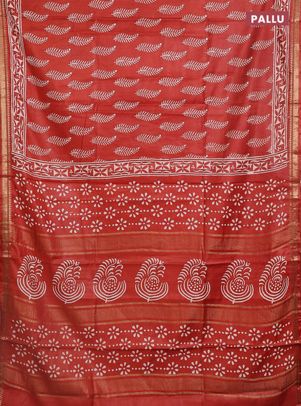 Semi bhagalpuri saree rust with allover prints and zari woven border