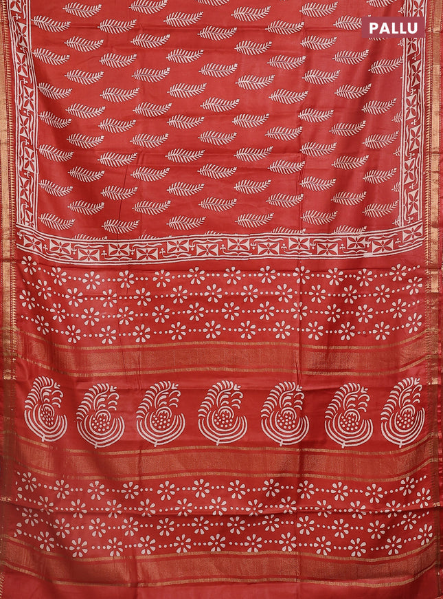Semi bhagalpuri saree rust with allover prints and zari woven border