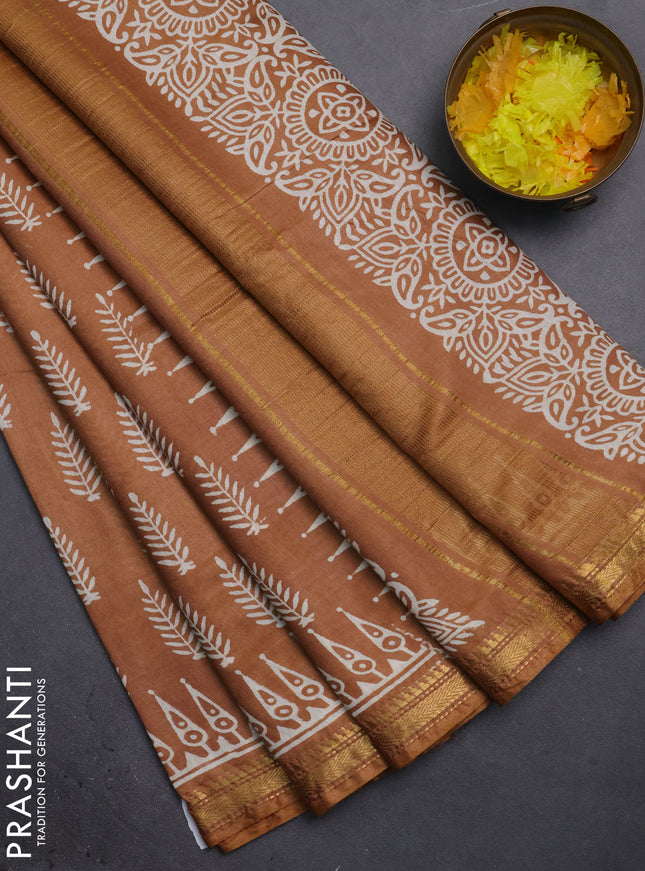 Semi bhagalpuri saree sandal with allover prints and zari woven border