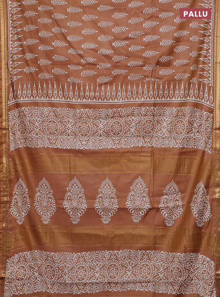 Semi bhagalpuri saree sandal with allover prints and zari woven border