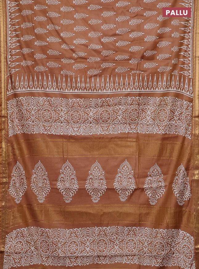 Semi bhagalpuri saree sandal with allover prints and zari woven border