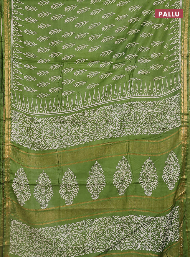 Semi bhagalpuri saree light green with allover prints and zari woven border