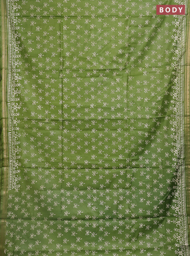 Semi bhagalpuri saree light green with allover prints and zari woven border