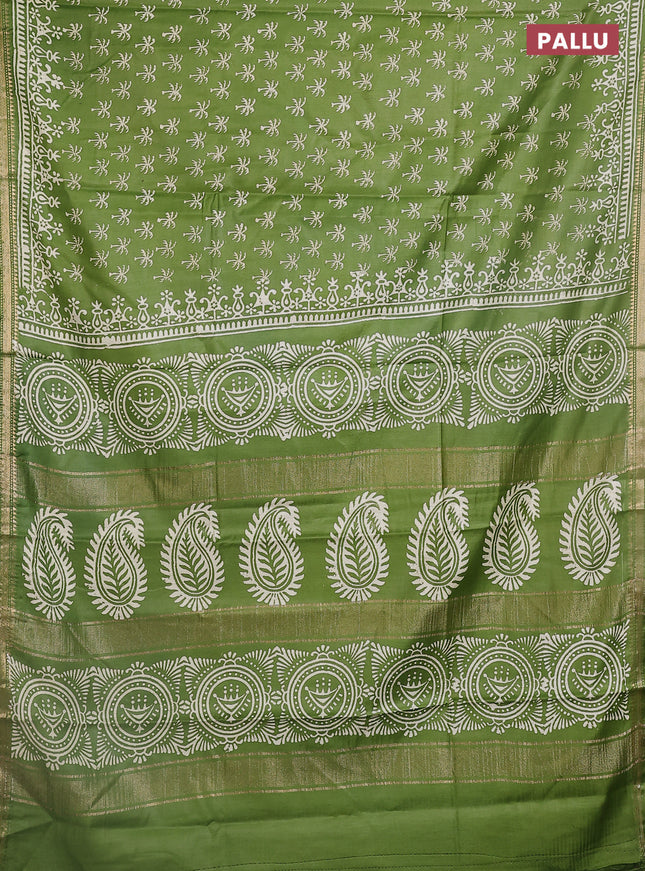 Semi bhagalpuri saree light green with allover prints and zari woven border