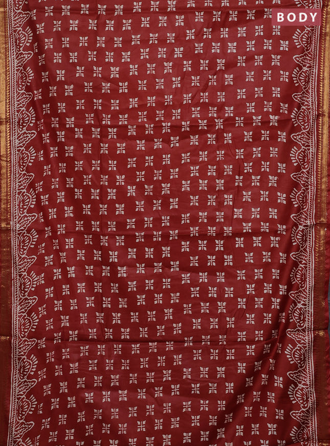 Semi bhagalpuri saree rust with allover prints and zari woven border
