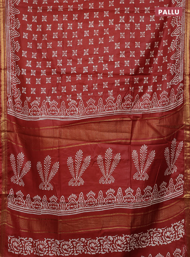Semi bhagalpuri saree rust with allover prints and zari woven border