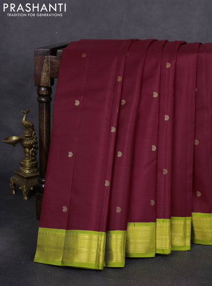 Pure kanchipuram silk saree maroon and fluorescent green with paisley zari woven buttas and zari woven korvai border