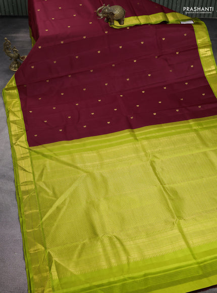 Pure kanchipuram silk saree maroon and fluorescent green with paisley zari woven buttas and zari woven korvai border