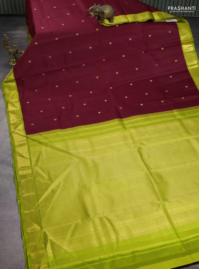 Pure kanchipuram silk saree maroon and fluorescent green with paisley zari woven buttas and zari woven korvai border