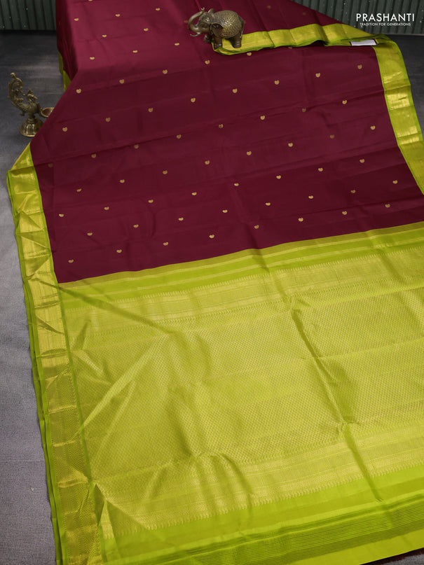 Pure kanchipuram silk saree maroon and fluorescent green with paisley zari woven buttas and zari woven korvai border