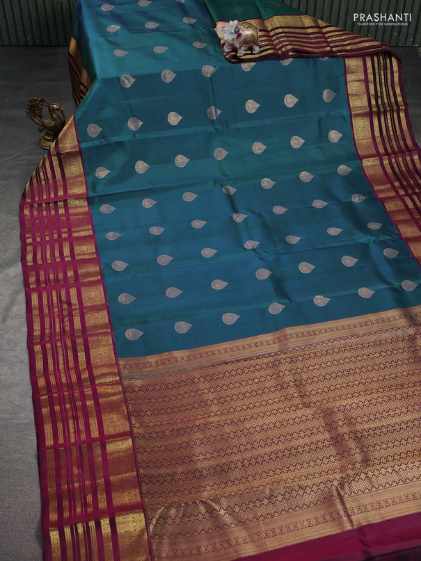 Pure kanchipuram silk saree dual shade of bluish green and dark magenta pink with zari woven buttas and long zari woven border