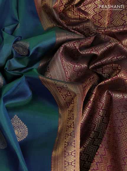 Pure kanchipuram silk saree dual shade of bluish green and dark magenta pink with zari woven buttas and long zari woven border