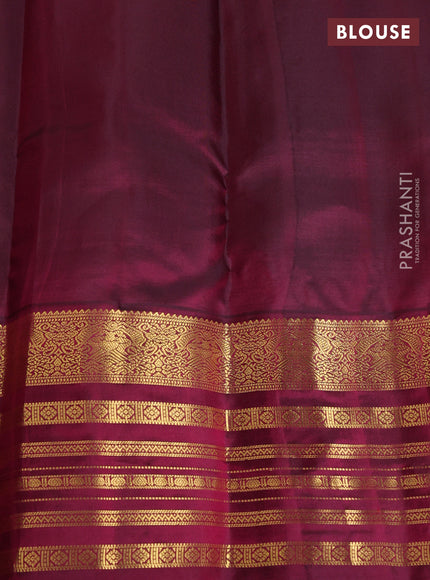 Pure kanchipuram silk saree dual shade of bluish green and dark magenta pink with zari woven buttas and long zari woven border