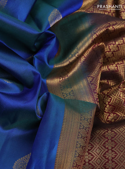 Pure kanchipuram silk saree dual shade of bluish green and dark magenta pink with zari woven buttas and long zari woven border