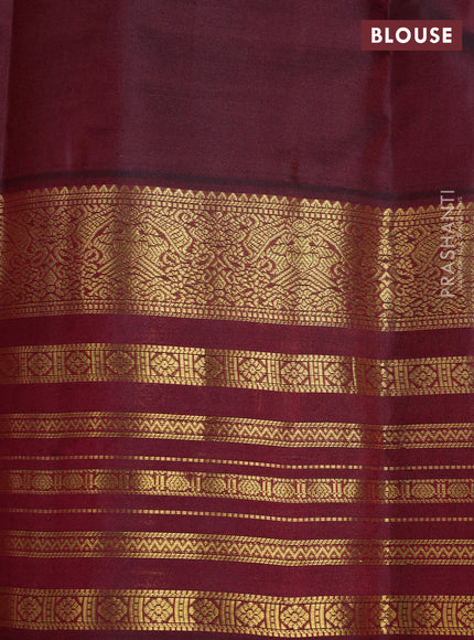 Pure kanchipuram silk saree dual shade of bluish green and dark magenta pink with zari woven buttas and long zari woven border
