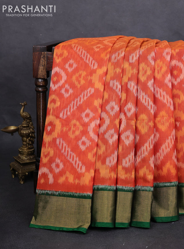 Ikat silk cotton saree orange and green with alover ikat weaves and zari woven border