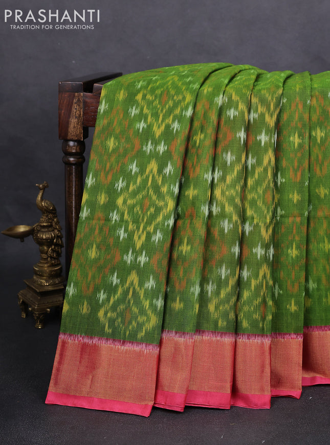 Ikat silk cotton saree green and peach pink with alover ikat weaves and zari woven border