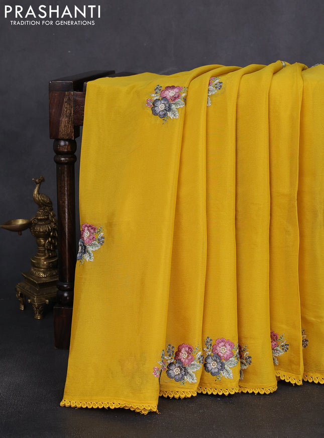 Chiffon silk saree mustard yellow with floral embroidery and lace work border