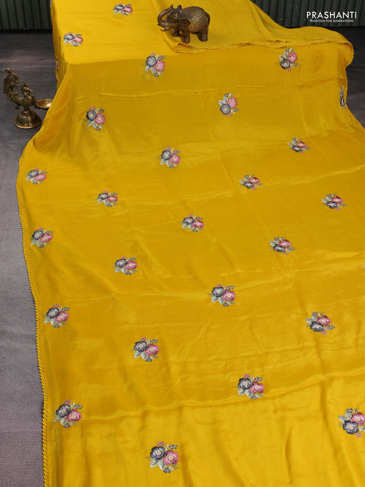 Chiffon silk saree mustard yellow with floral embroidery and lace work border