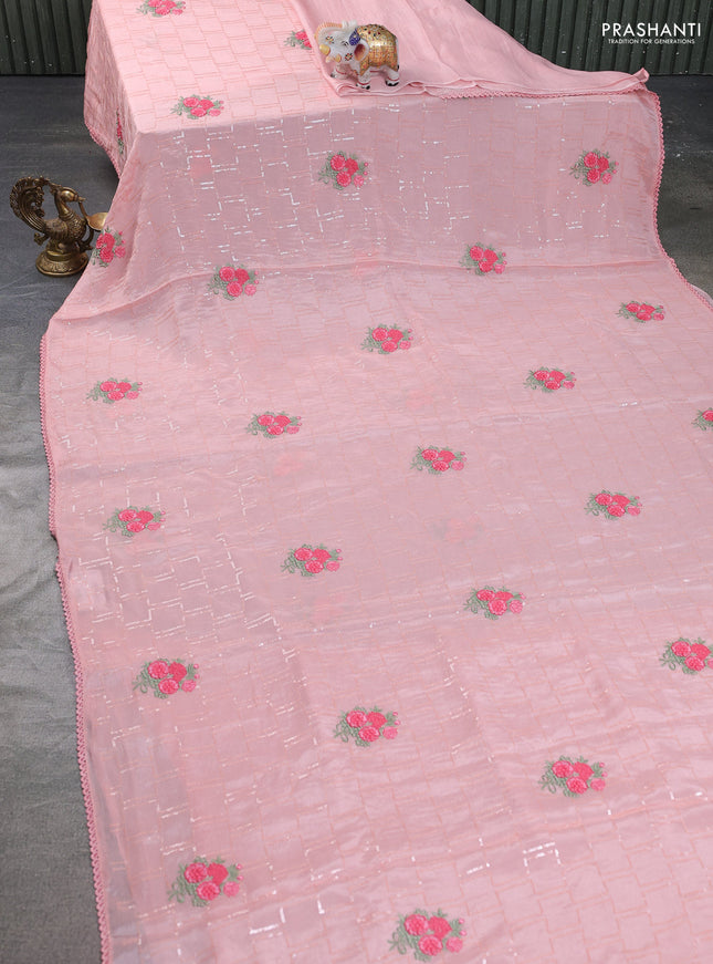 Chiffon silk saree peach shade with sequin work & floral embroidery and lace work border