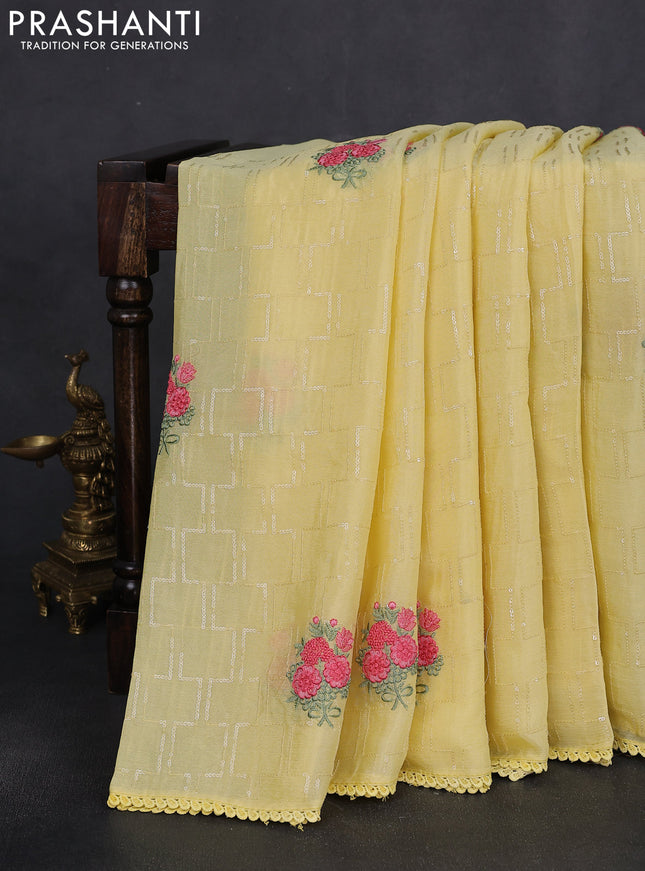 Chiffon silk saree pale yellow with sequin work & floral embroidery and lace work border