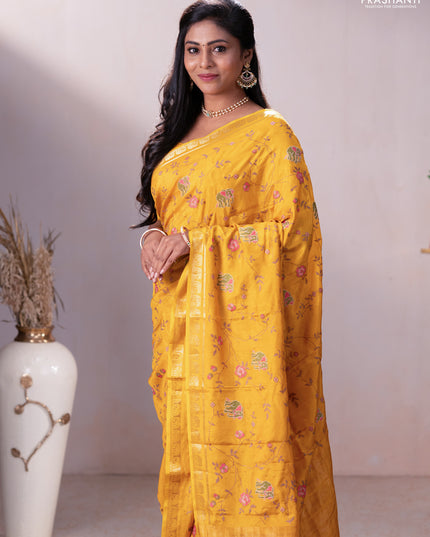 Semi crepe silk saree mustard yellow with allover convent embroidery and elephant zari woven border