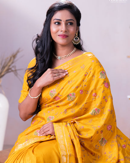 Semi crepe silk saree mustard yellow with allover convent embroidery and elephant zari woven border