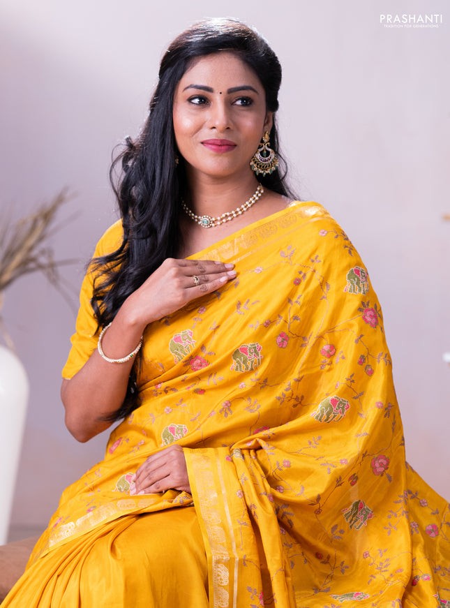 Semi crepe silk saree mustard yellow with allover convent embroidery and elephant zari woven border
