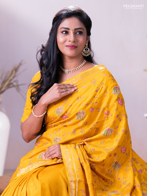 Semi crepe silk saree mustard yellow with allover convent embroidery and elephant zari woven border