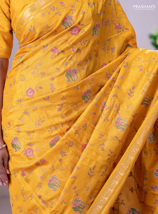 Semi crepe silk saree mustard yellow with allover convent embroidery and elephant zari woven border