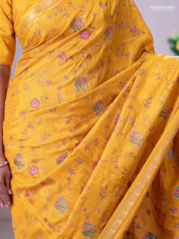 Semi crepe silk saree mustard yellow with allover convent embroidery and elephant zari woven border