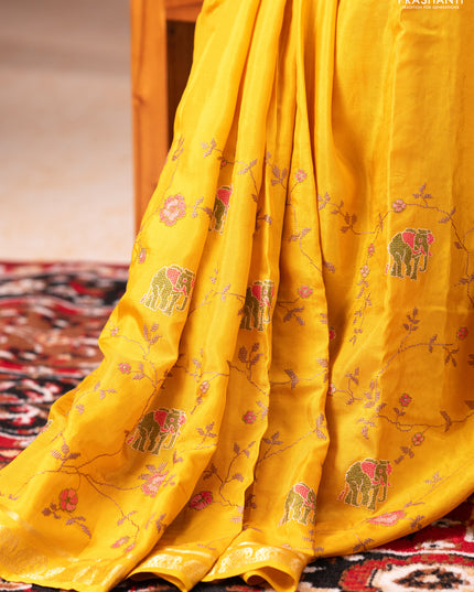 Semi crepe silk saree mustard yellow with allover convent embroidery and elephant zari woven border