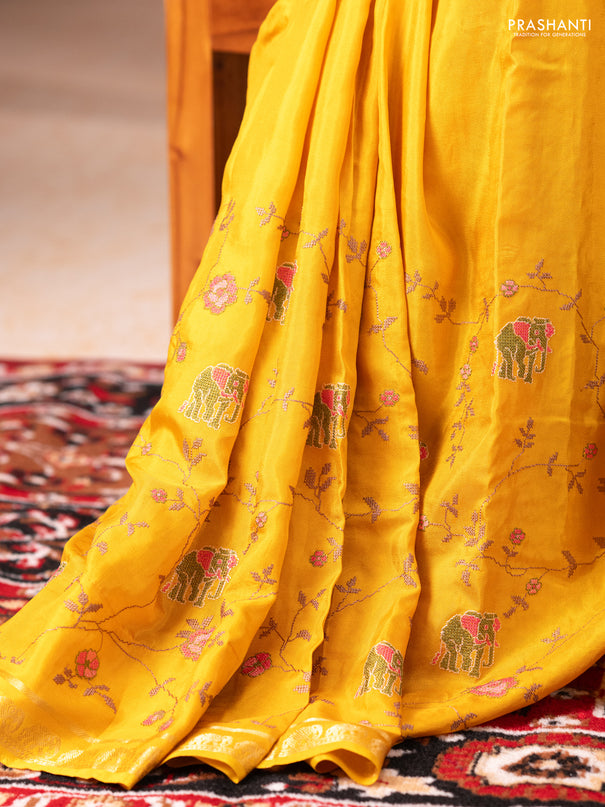 Semi crepe silk saree mustard yellow with allover convent embroidery and elephant zari woven border