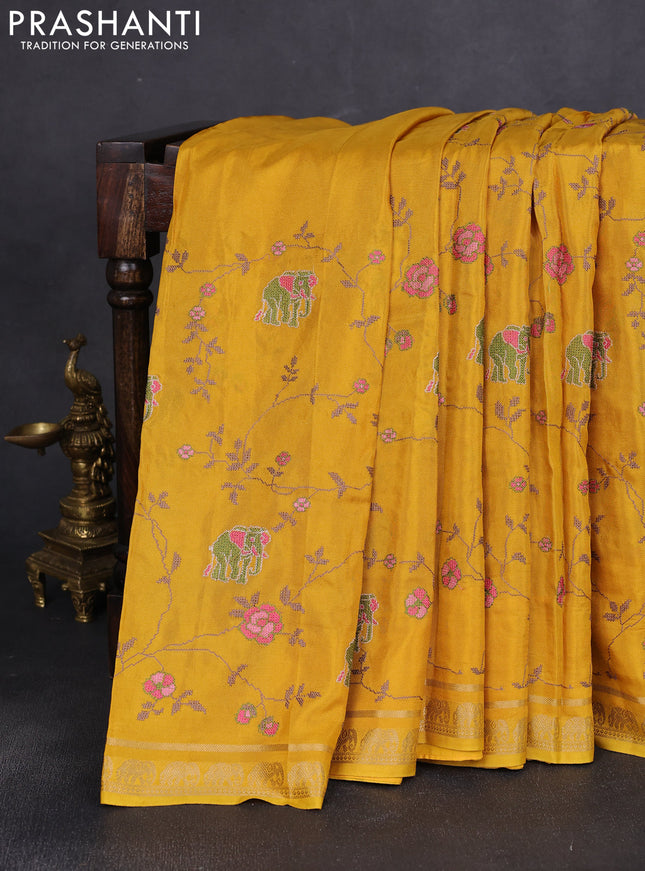 Semi crepe silk saree mustard yellow with allover convent embroidery and elephant zari woven border