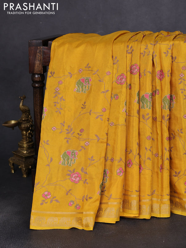 Semi crepe silk saree mustard yellow with allover convent embroidery and elephant zari woven border