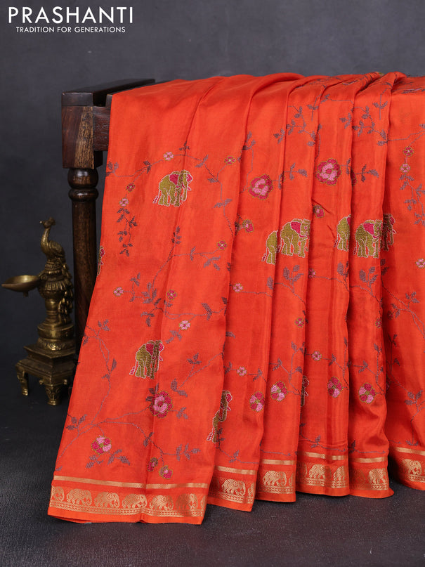 Semi crepe silk saree orange with allover convent embroidery and elephant zari woven border