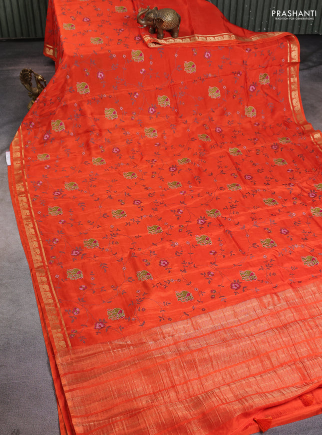 Semi crepe silk saree orange with allover convent embroidery and elephant zari woven border