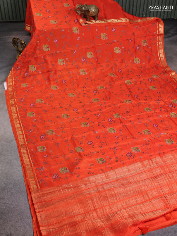Semi crepe silk saree orange with allover convent embroidery and elephant zari woven border