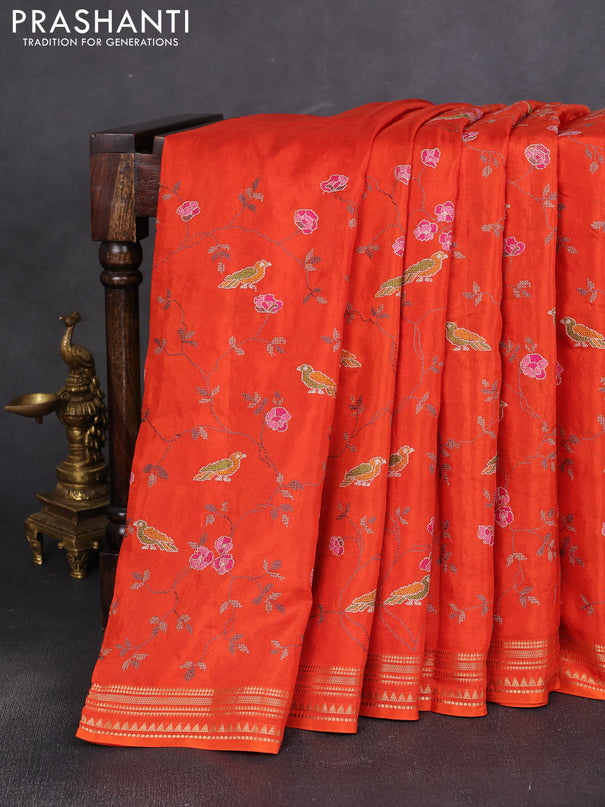 Semi crepe silk saree orange with allover convent embroidery and temple zari woven border