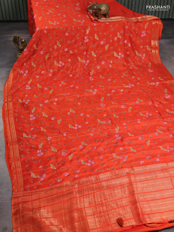 Semi crepe silk saree orange with allover convent embroidery and temple zari woven border